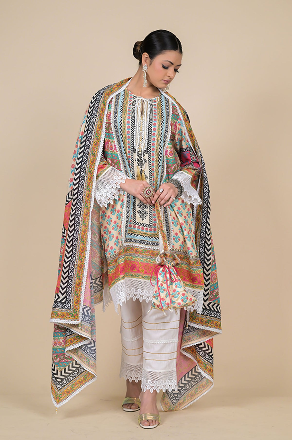 Orange Cotton Muslin Suit with Multicolor Dupatta & Potli Bag