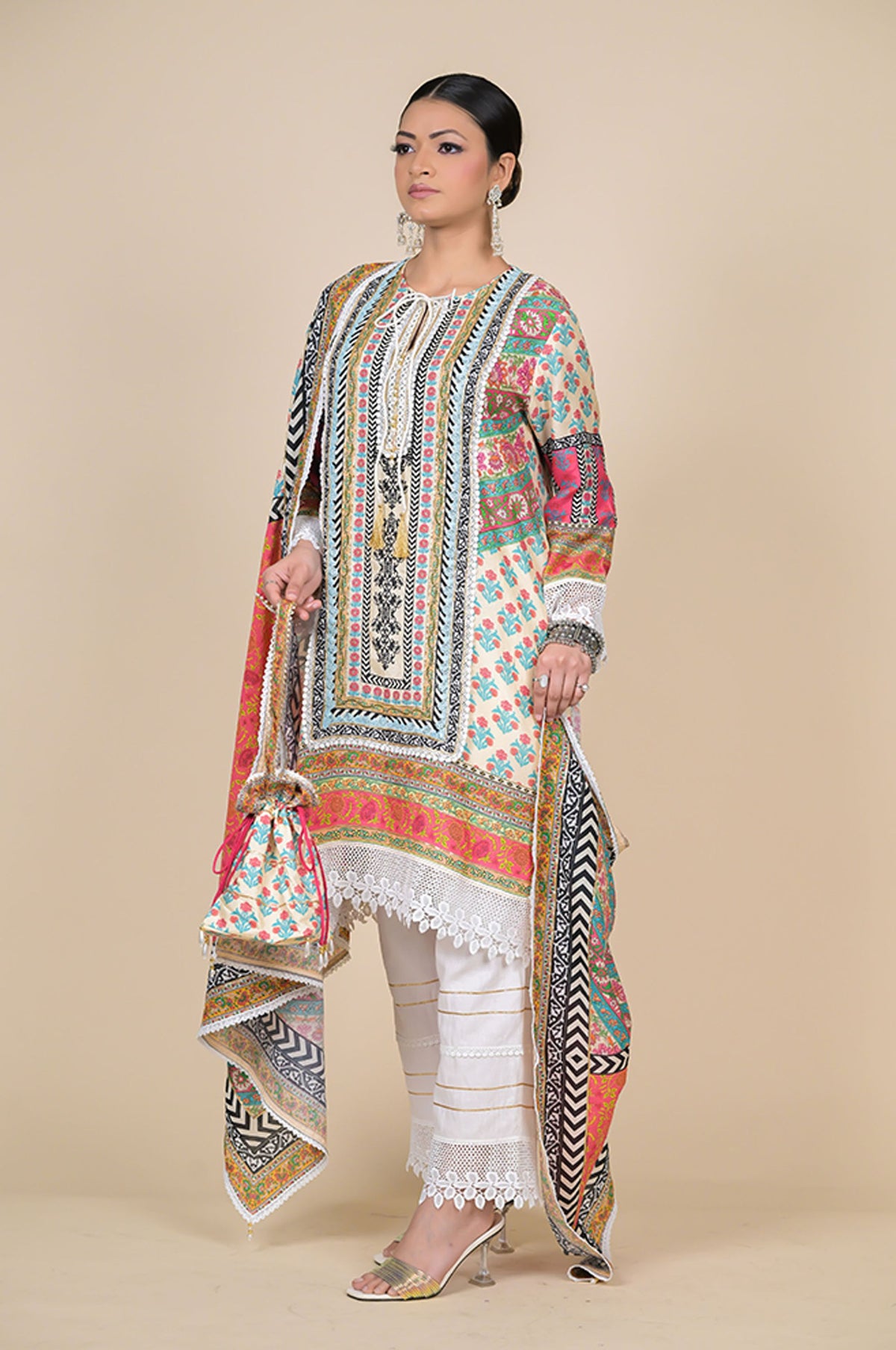 Orange Cotton Muslin Suit with Multicolor Dupatta & Potli Bag
