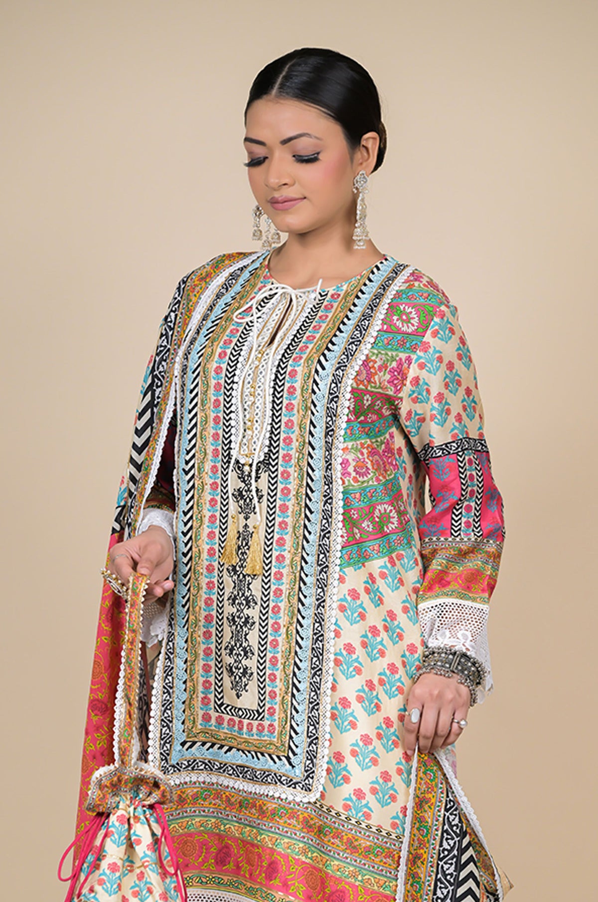Orange Cotton Muslin Suit with Multicolor Dupatta & Potli Bag