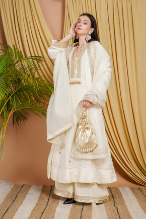 Ivory Cotton Silk Mirror Work Suit Set with Embellished Dupatta & Potli